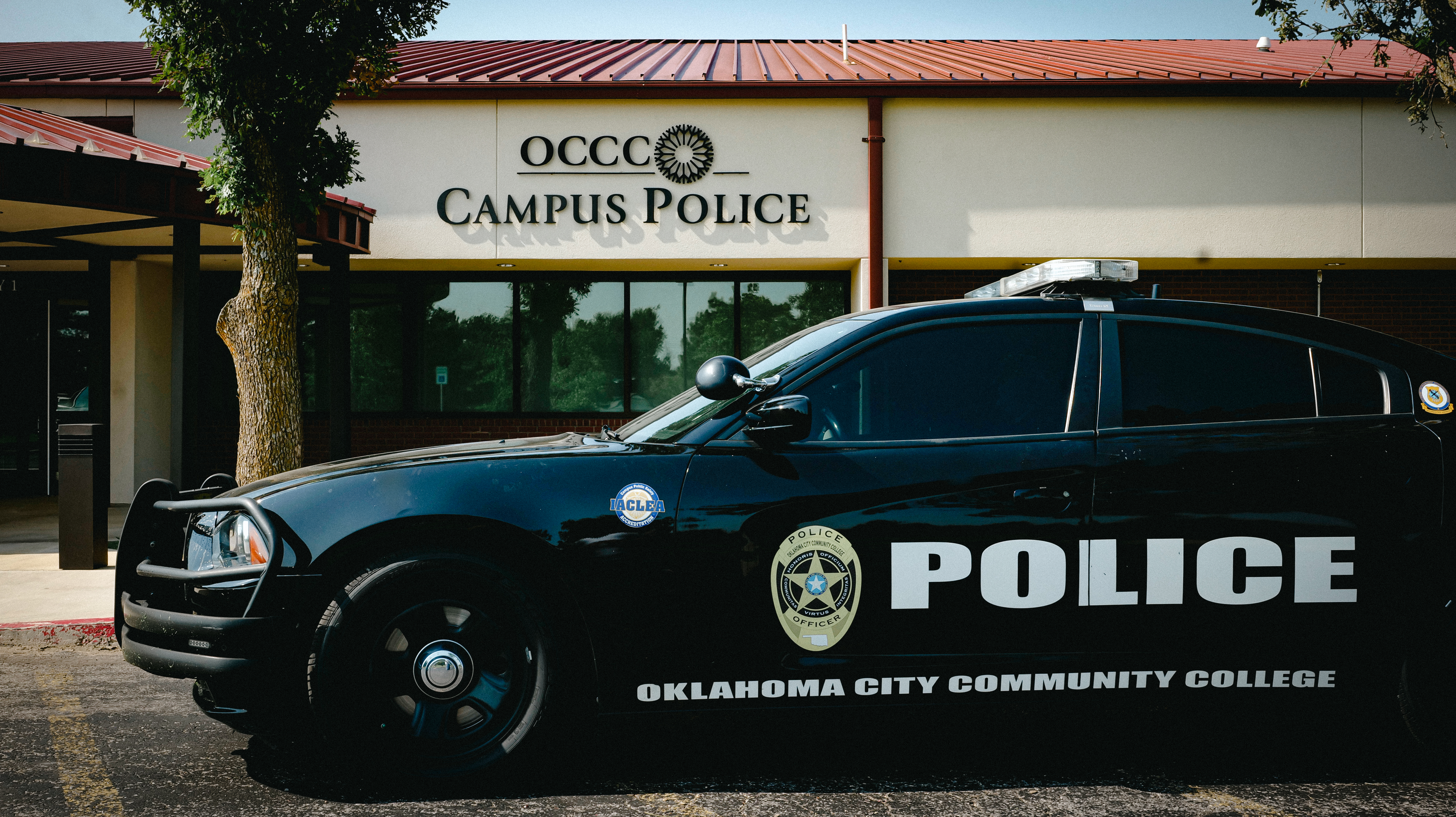 A police car parked in front of the Oklahoma City Community College Police Department building.